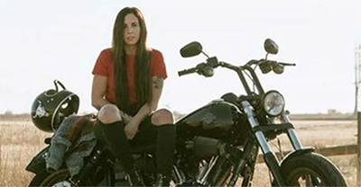 Woman sitting on a motorcycle