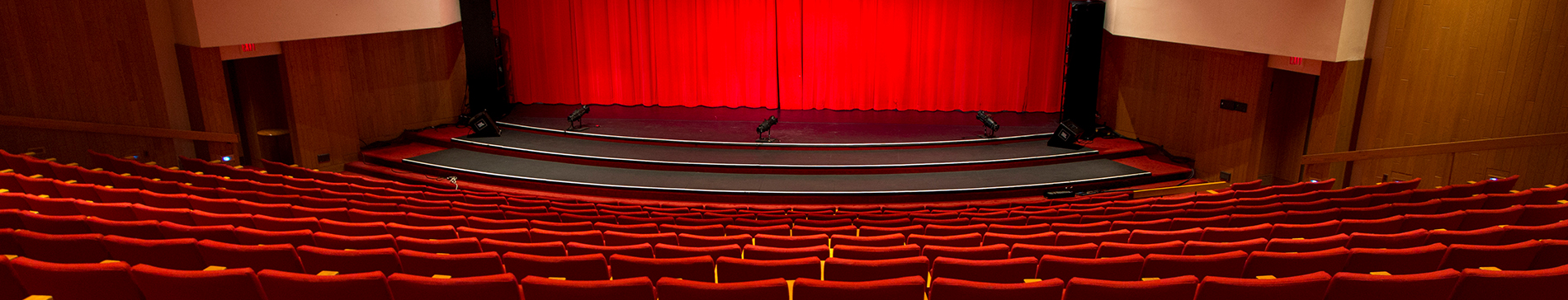 Sentry theater red seats and stage with red curtain