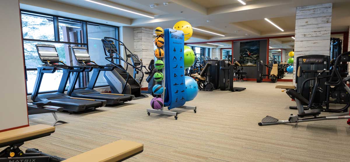 Cardio machines and workout mats in the Fitness Center