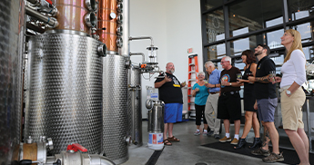 People gathering in the Stevens Point Brewery for a tour