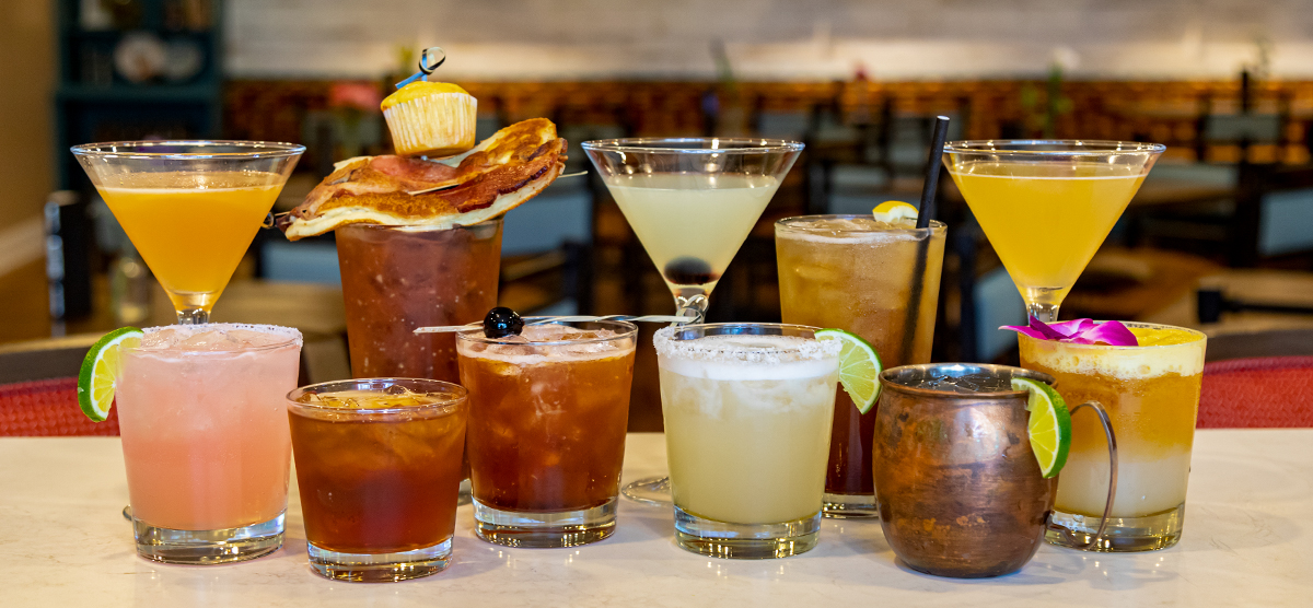 Cocktails laid out in a row at the Library Cafe