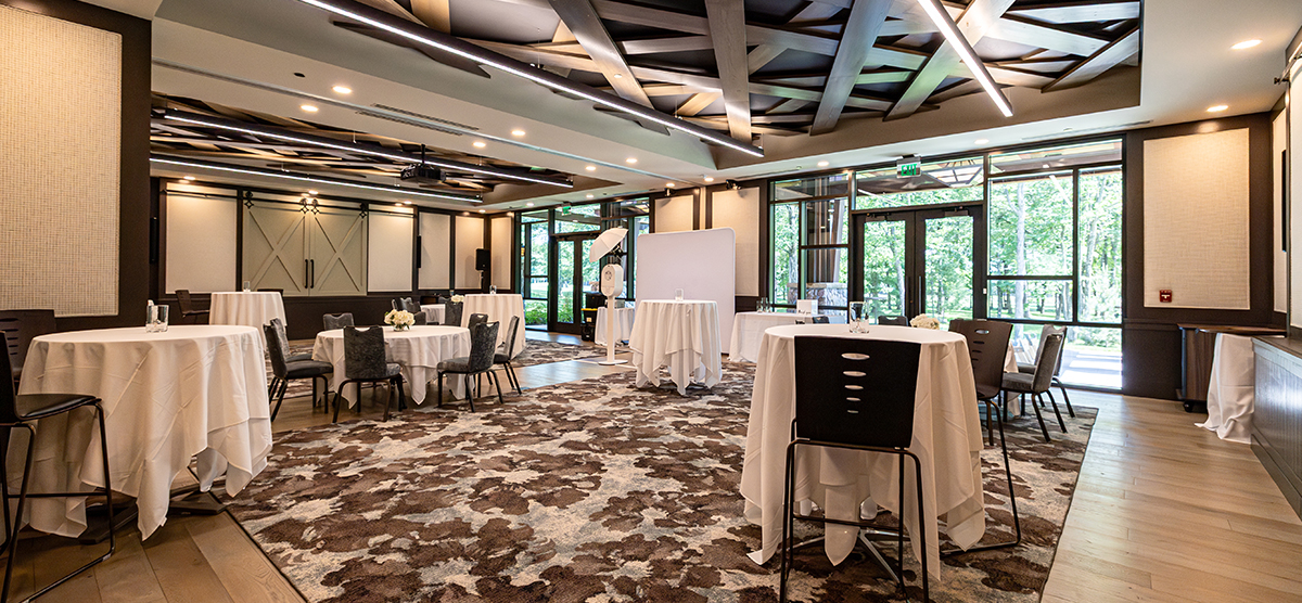 carousel-wedding-venue-inn-gathering-rooms-2-1200x556 Round tables with chairs in The Inn gathering room.