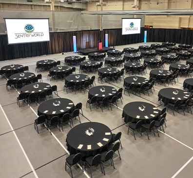 Aerial view of the SentryWorld fieldhouse set up for a corporate meeting