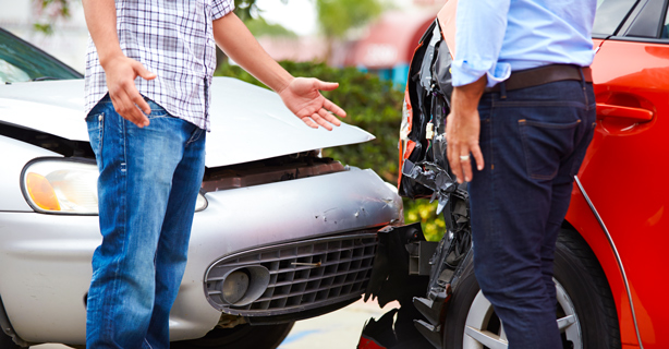 Two people talking after car accident