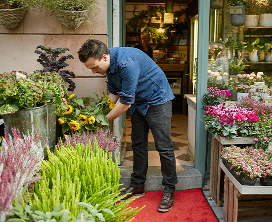 Florist inspecting damage