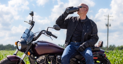 Motorcycle rider drinking water