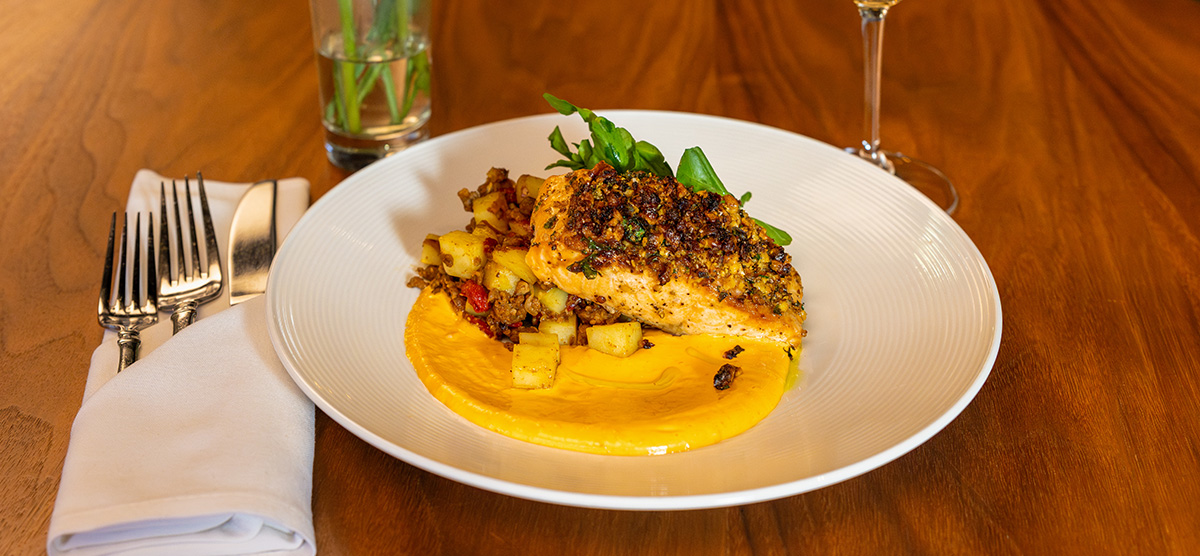 Plate of walnut herb crusted salmon.