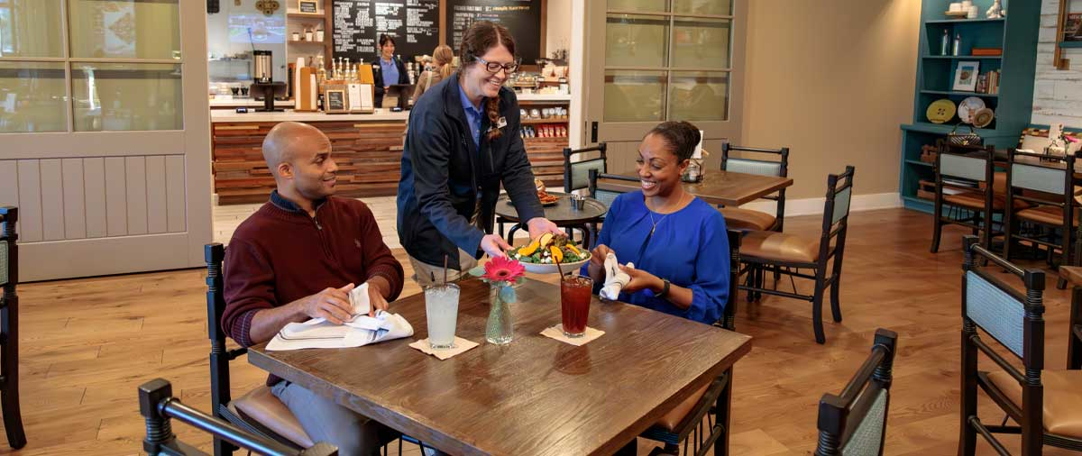 Guests being served by staff in the Library Cafe