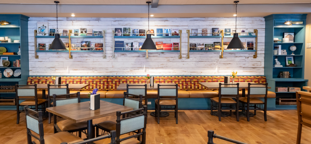 Library Cafe seating with shelves of books in the background.