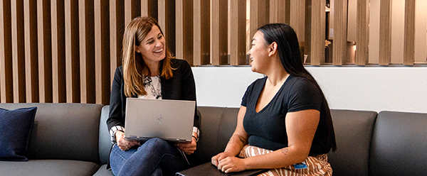 A mentor and an intern having a conversation at Sentry home office.