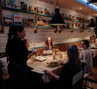 card-intimate-dining-396x364 Guests dine at The Library for diner.