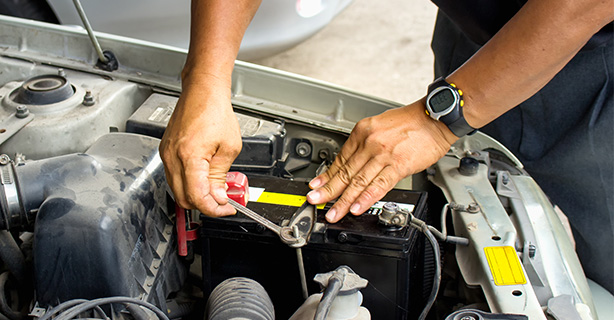 Man working on a car battery