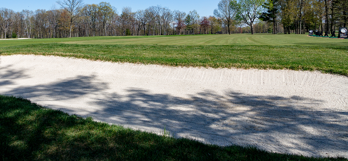 Fairway bunker placed alongside the outdoor driving range at SentryWorld