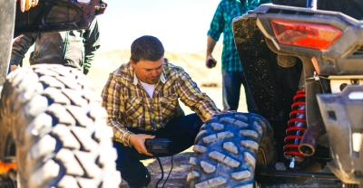 Man working on ATV