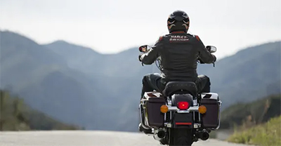 Motorcycle rider wearing a Harley-Davidson jacket