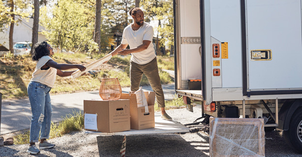 Man and woman unloading a moving van