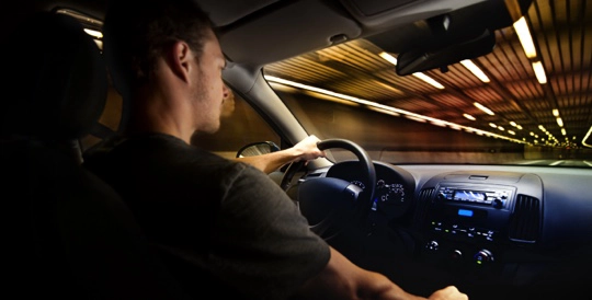 a person driving through a tunnel at high speed