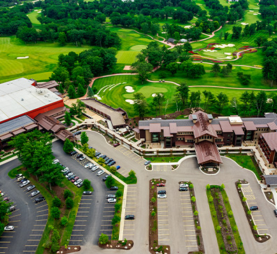 Aerial view of The Inn at SentryWorld, the main property, golf course, and the parking lot