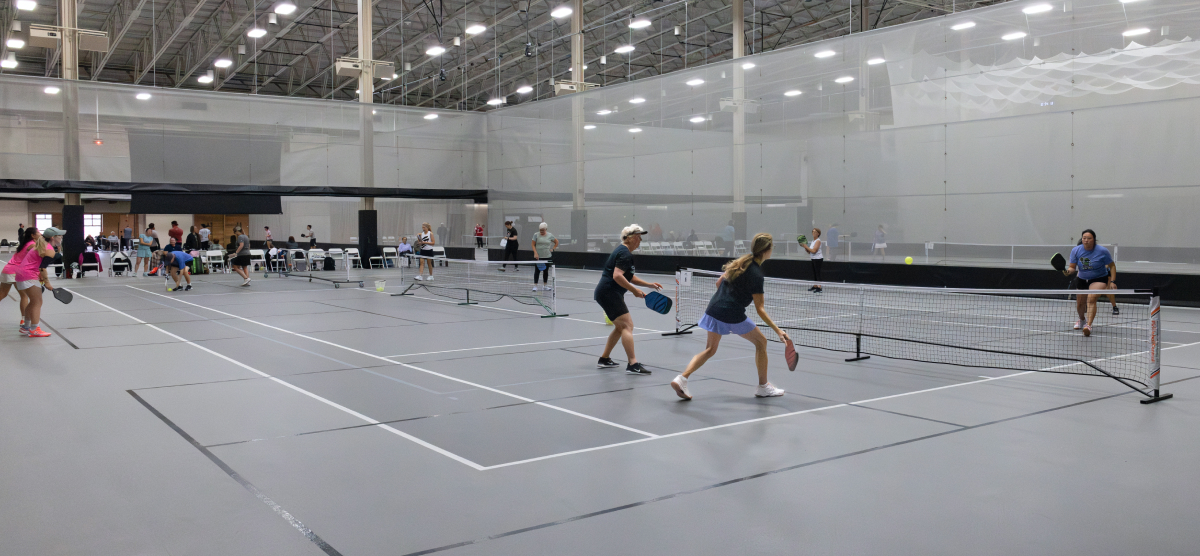 carousel-fall-league-signup-pickleball-1-1200x556 Players play pickleball at the SentryWorld fieldhouse.