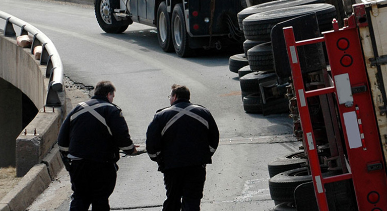 Semi trailer truck turned on side from accident