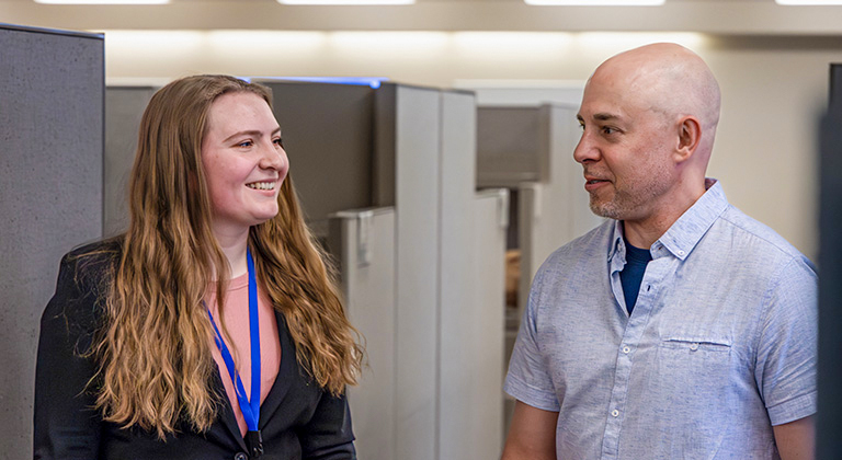 An intern and a Sentry associate having a conversation.