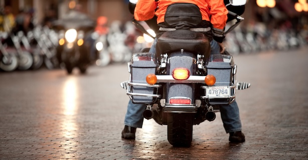 Rear lights of motorcycle stopped on street