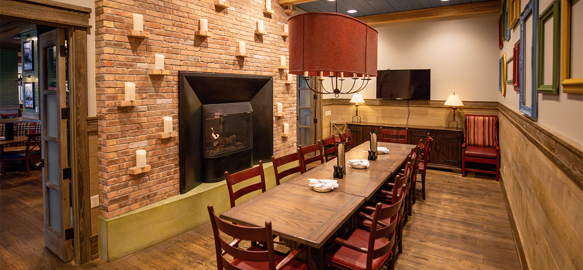 Fireplace and dining table in the Celebration Room at PJ's - SentryWorld