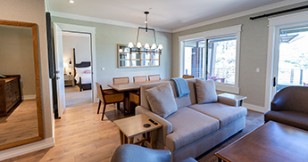 Couch and table shown in an executive suite room at the Inn