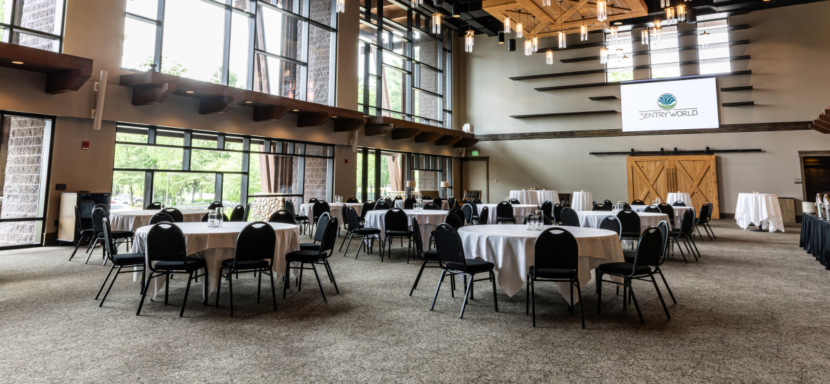 carousel-corporate-event-full-day-1-1200x556 Tables set in the Atrium for a meeting.