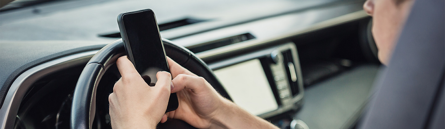 Person texting and driving distracted