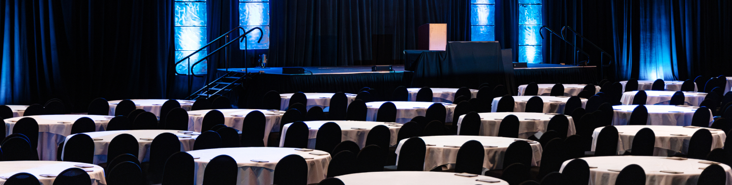 hero-corporate-events-1440x364 Table set in the SentryWorld Fieldhouse for an event.