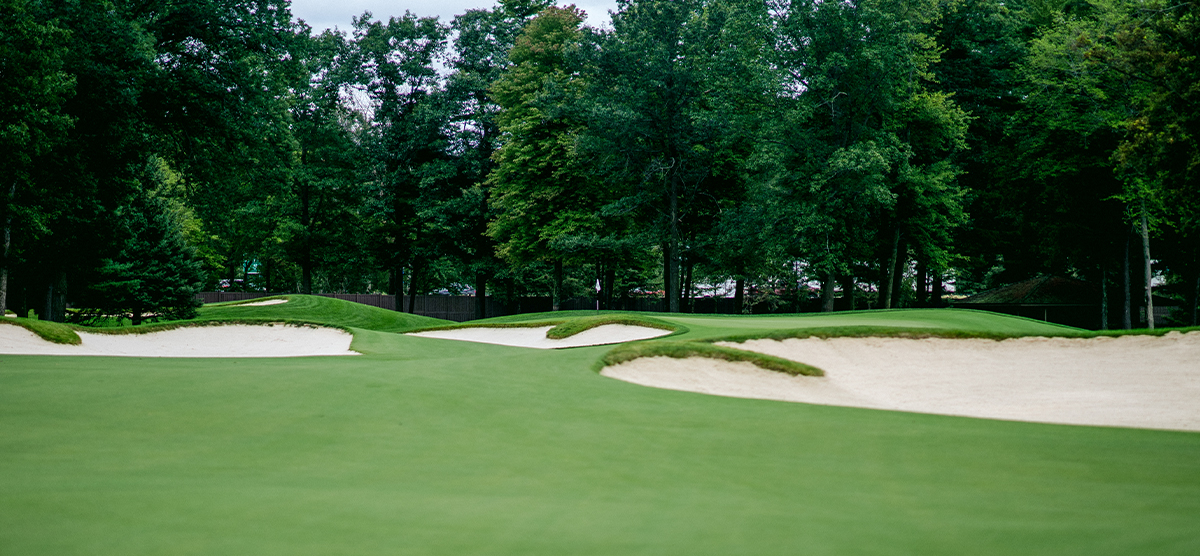 Three sand traps by the eighth hole putting green at SentryWorld