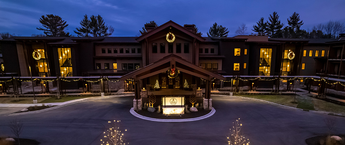 Aerial view of The Inn at SentryWorld with holiday lights in the evening