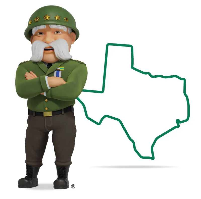 The General standing in front of Texas with his arms crossed and a smile.