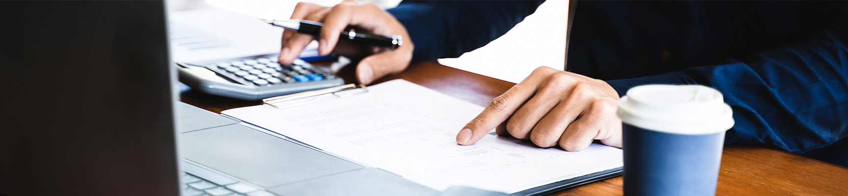 An underwriting associate reviewing details of a policy.