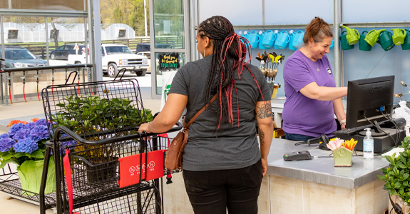 Customer purchasing plants in a store