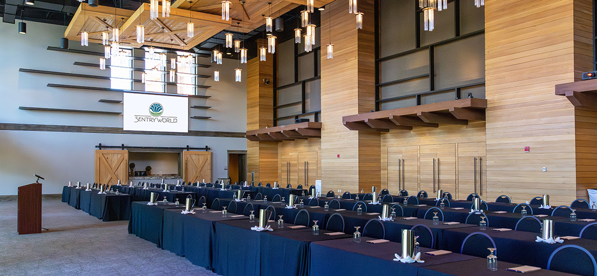 Rows of tables set for a meeting in the Atrium at SentryWorld