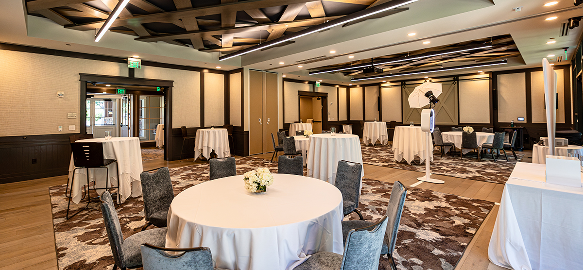 carousel-wedding-venue-inn-gathering-rooms-1-1200x556 Round tables with chairs in The Inn gathering room.