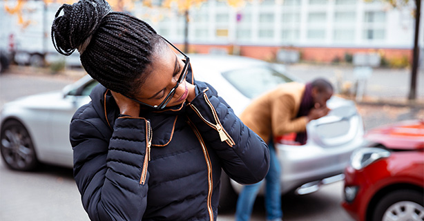 Woman suffering from neck pain after car accident