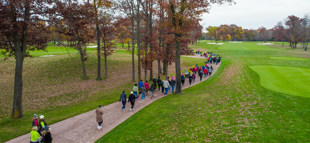 View of walkers on the golf cart path from above.