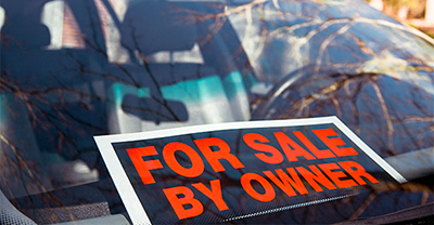 Car with a for sale sign