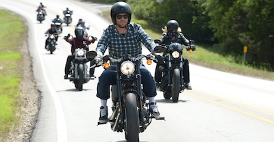 Group of motorcycle bikers riding together