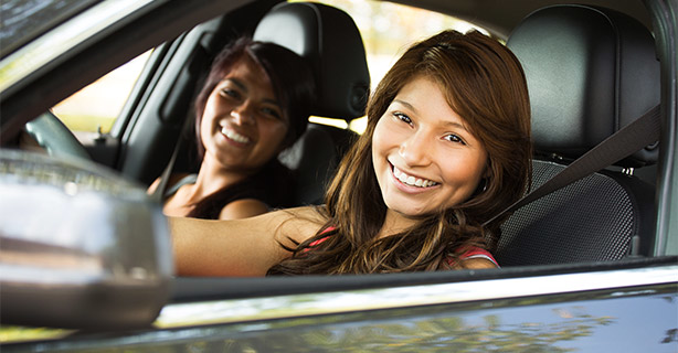 Two people looking out a vehicle's window