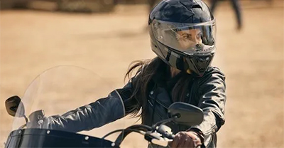 Woman rider with helmet and face shield