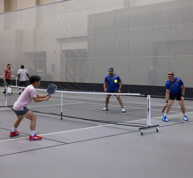 Pickleball game being played in the SentryWorld field house.