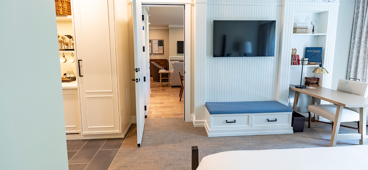 carousel-suite-golf-view-king-queen-3-1200x556 King bedroom looking into the parlor area.