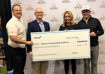 Sentry representatives handing donation check to Arizona Leadership Foundation