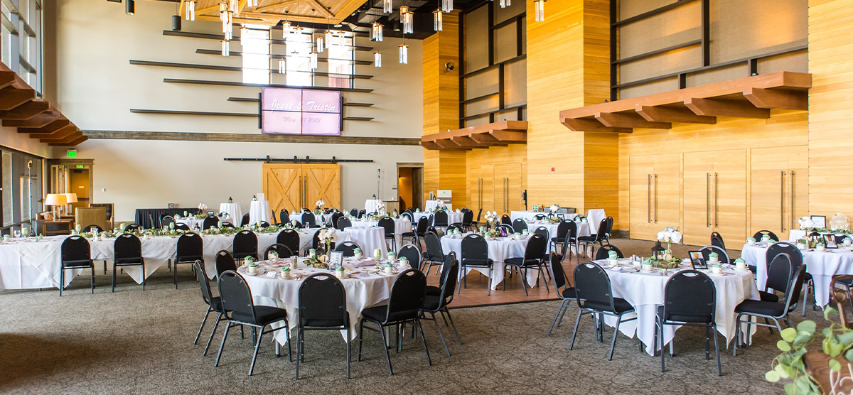 Tables and chairs set for a wedding reception in the Atrium