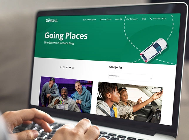 typing on a laptop with The General website on the screen