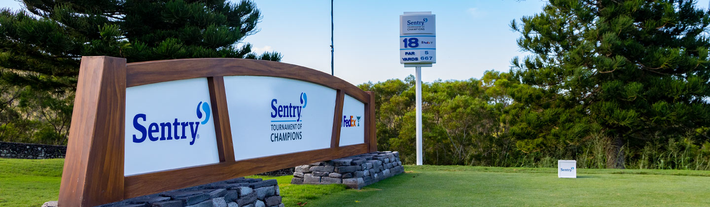 Sign with three logos: Sentry, Sentry Tournament of Champions, and Fedex